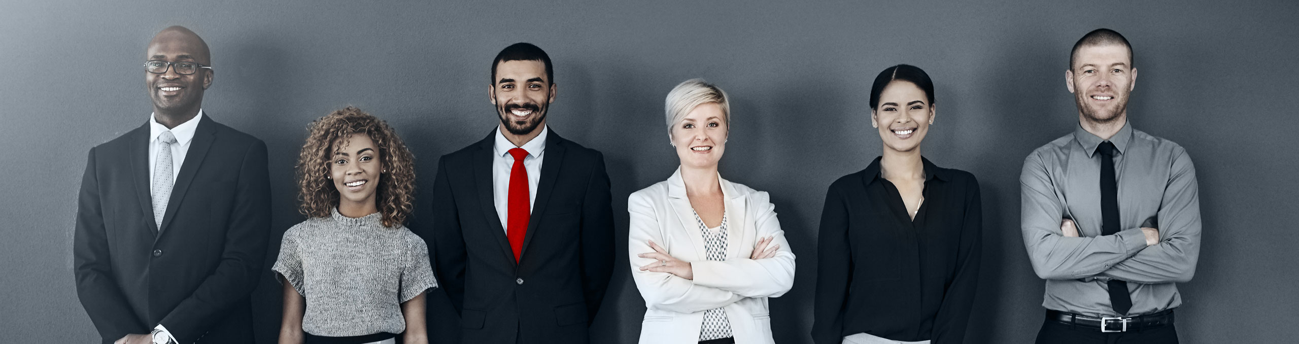 Six different smiling business people standing in a line