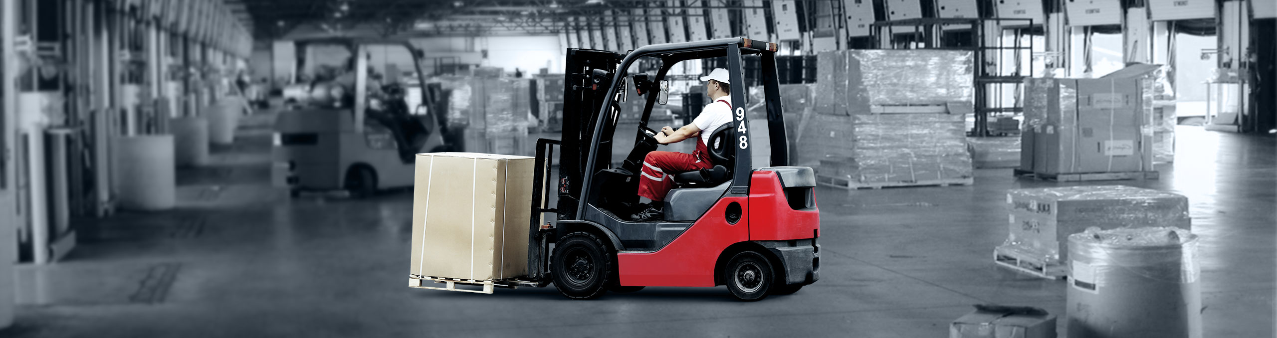  Forklift moving freight in cross dock facility