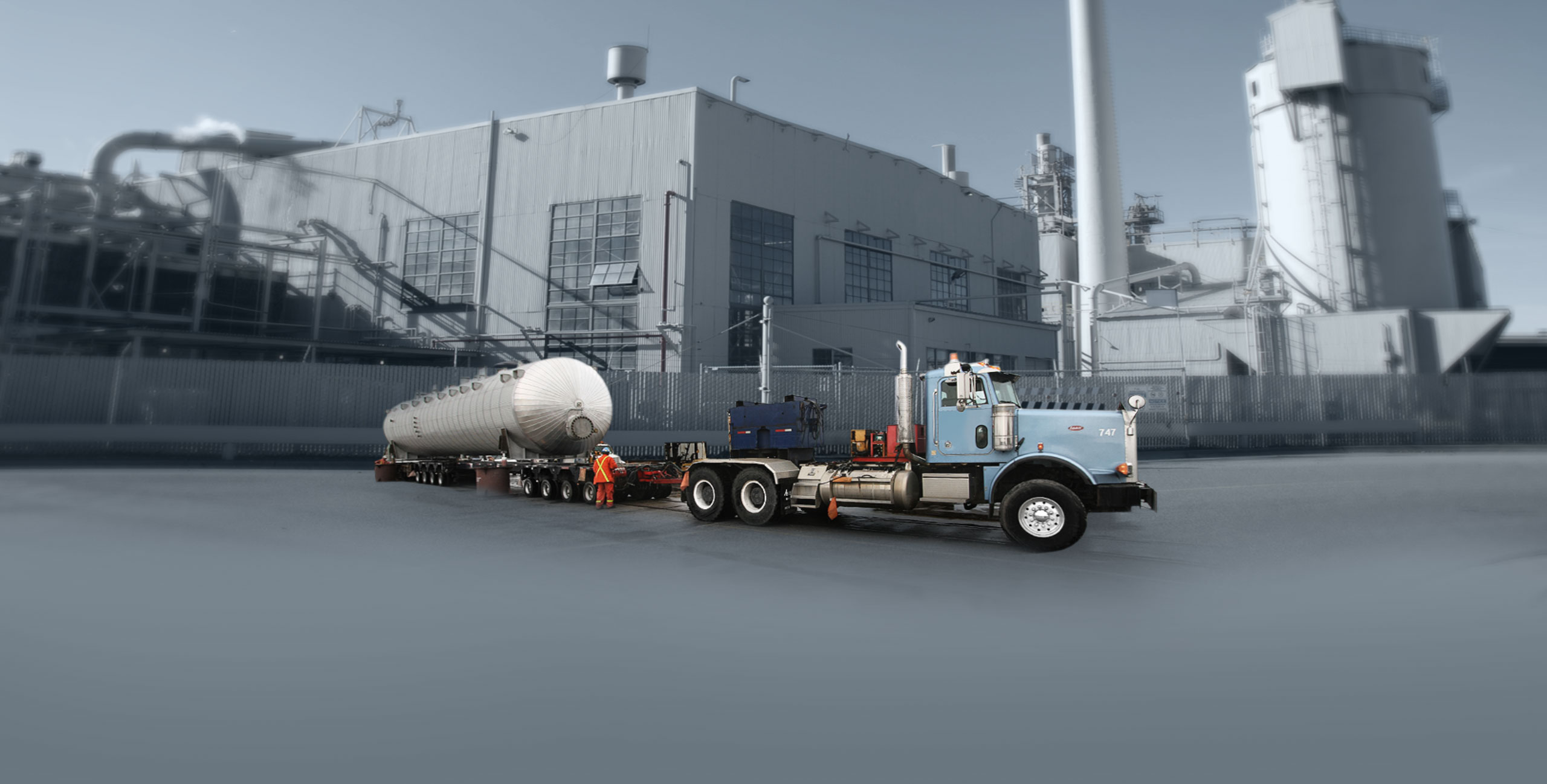 Man preparing a truck to haul oversized freight